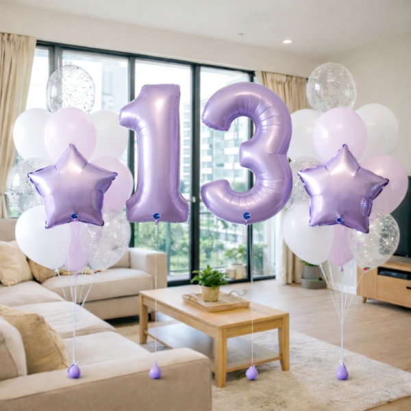 Lavender number balloon package with pastel purple foil age balloons, white and lavender helium balloon bouquets, confetti balloons and star foil balloons for birthday celebrations.
