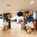 Organic balloon arch in gold, blue and white