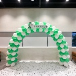 Starhub balloon arch in green and white