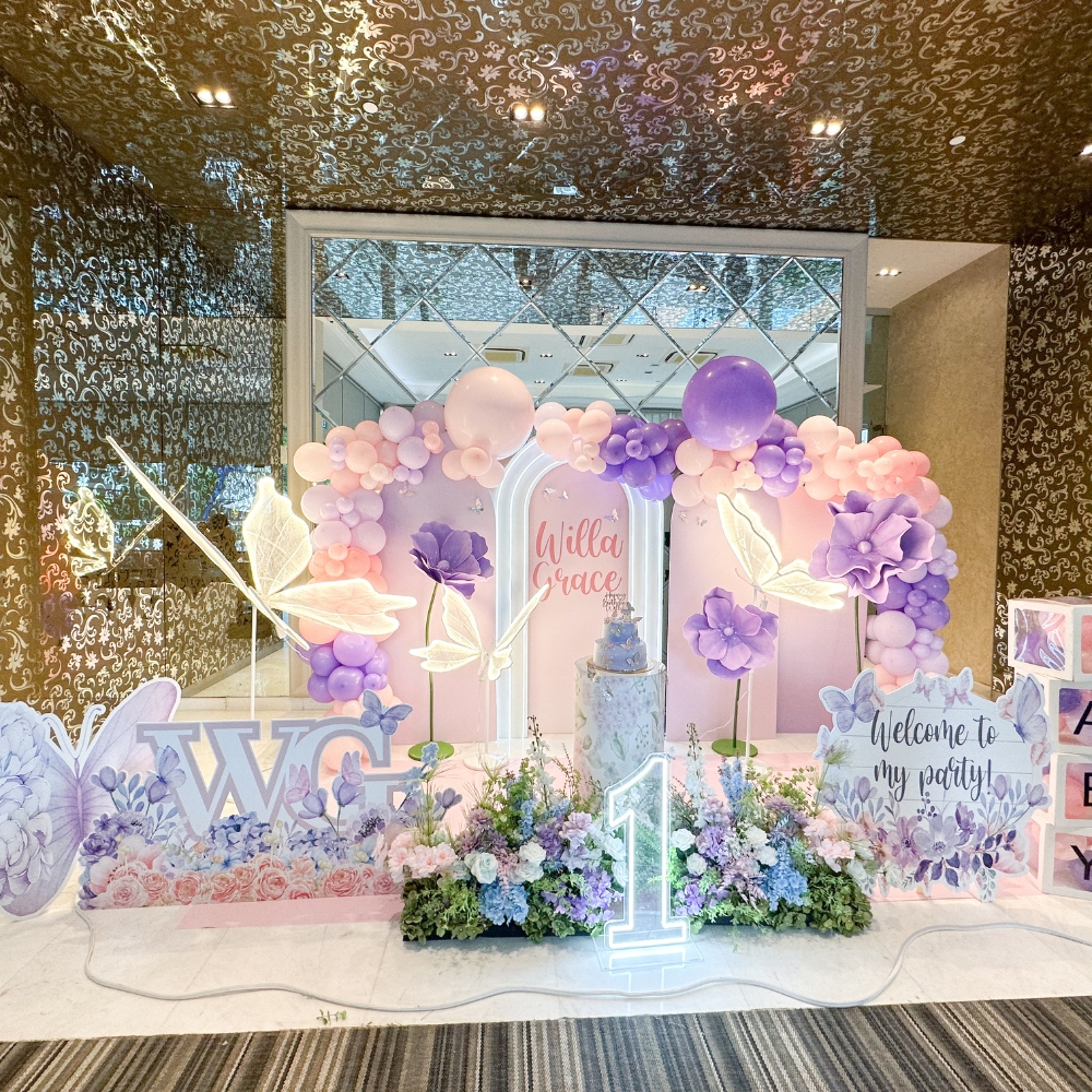 Butterfly and flower theme party backdrop with balloons