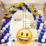 welcome back balloon arch with foil lettering